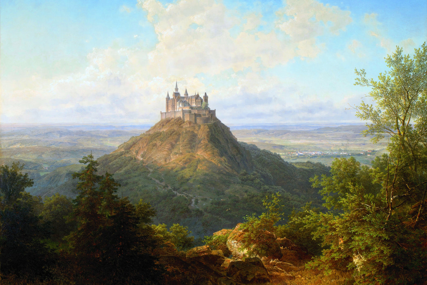 Castle on a hill with a landscape and trees in the foreground
