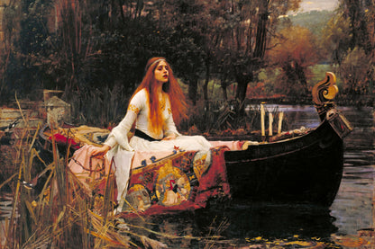 Woman in a boat on a river with a forested background