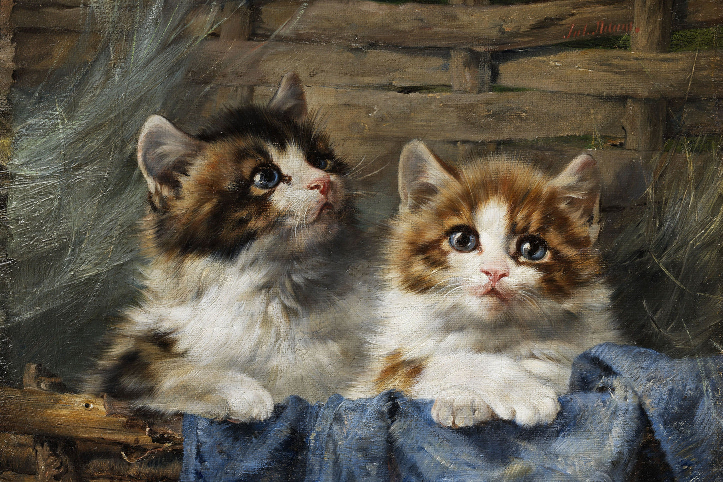 Two kittens sitting on a wooden surface with a textured background